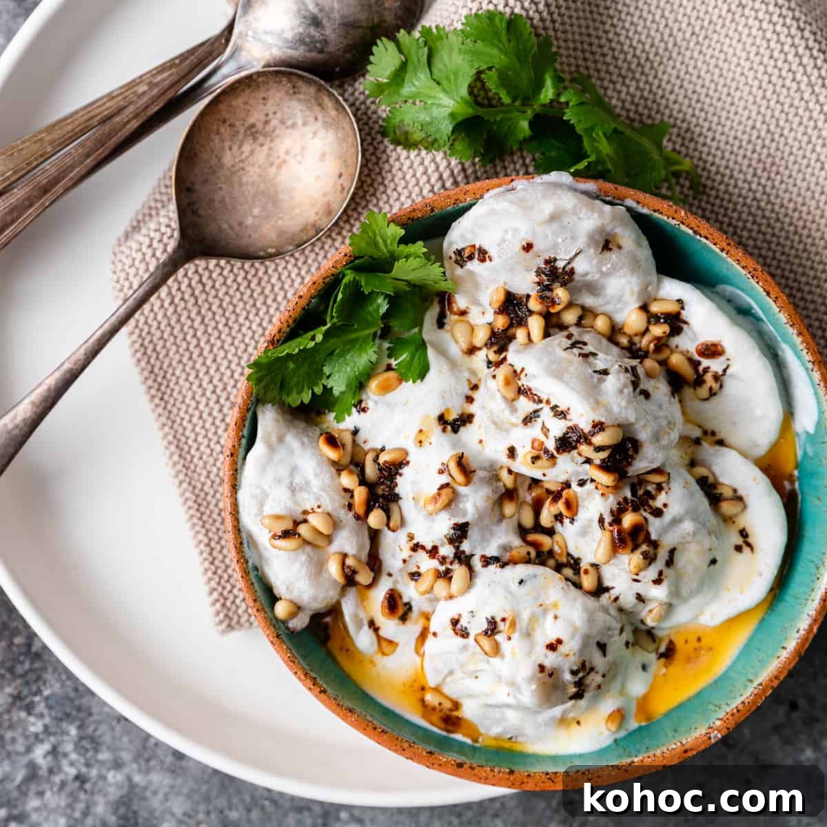 Shish Barak: Lebanese Lamb Dumplings in Yogurt Sauce 2 overhead: ready to serve shish barak on plate