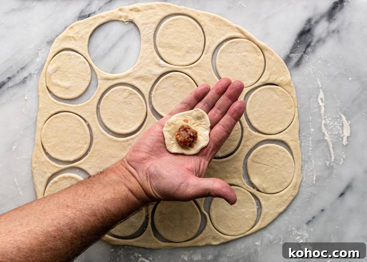 Shish Barak: Lebanese Lamb Dumplings in Yogurt Sauce 7 overhead: adding filling to dough