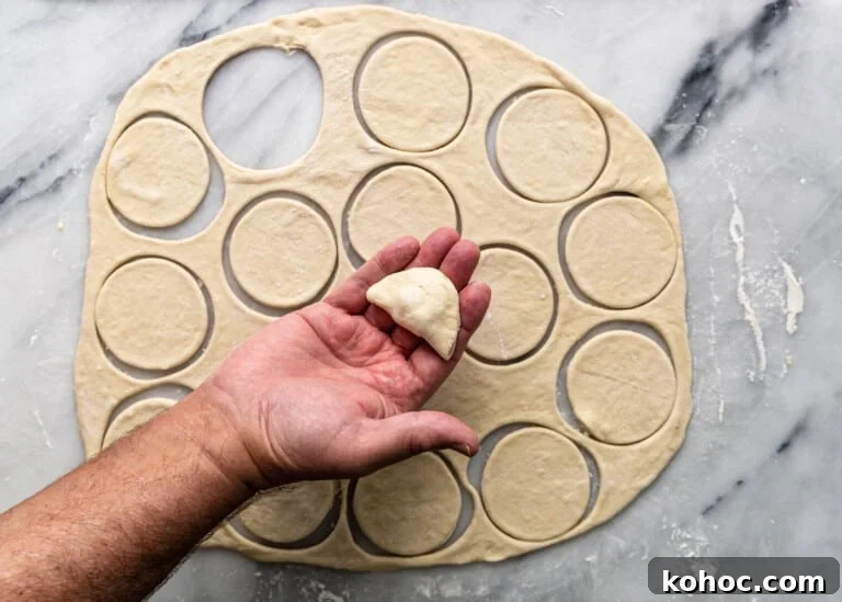 Shish Barak: Lebanese Lamb Dumplings in Yogurt Sauce 8 overhead: folding over dough for shish barak