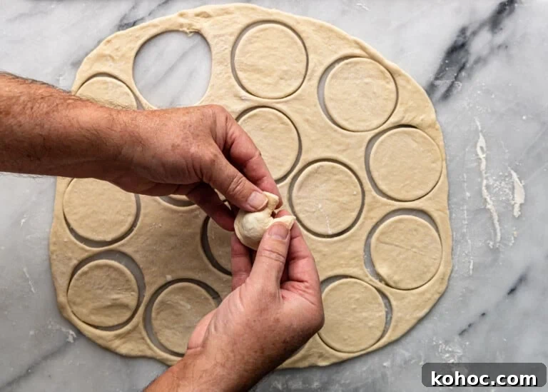 Shish Barak: Lebanese Lamb Dumplings in Yogurt Sauce 9 overhead: pinching the ends of dough together