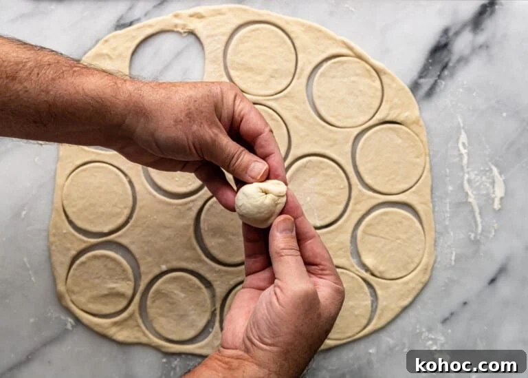 Shish Barak: Lebanese Lamb Dumplings in Yogurt Sauce 10 overhead: sealing meat dumpling before cooking