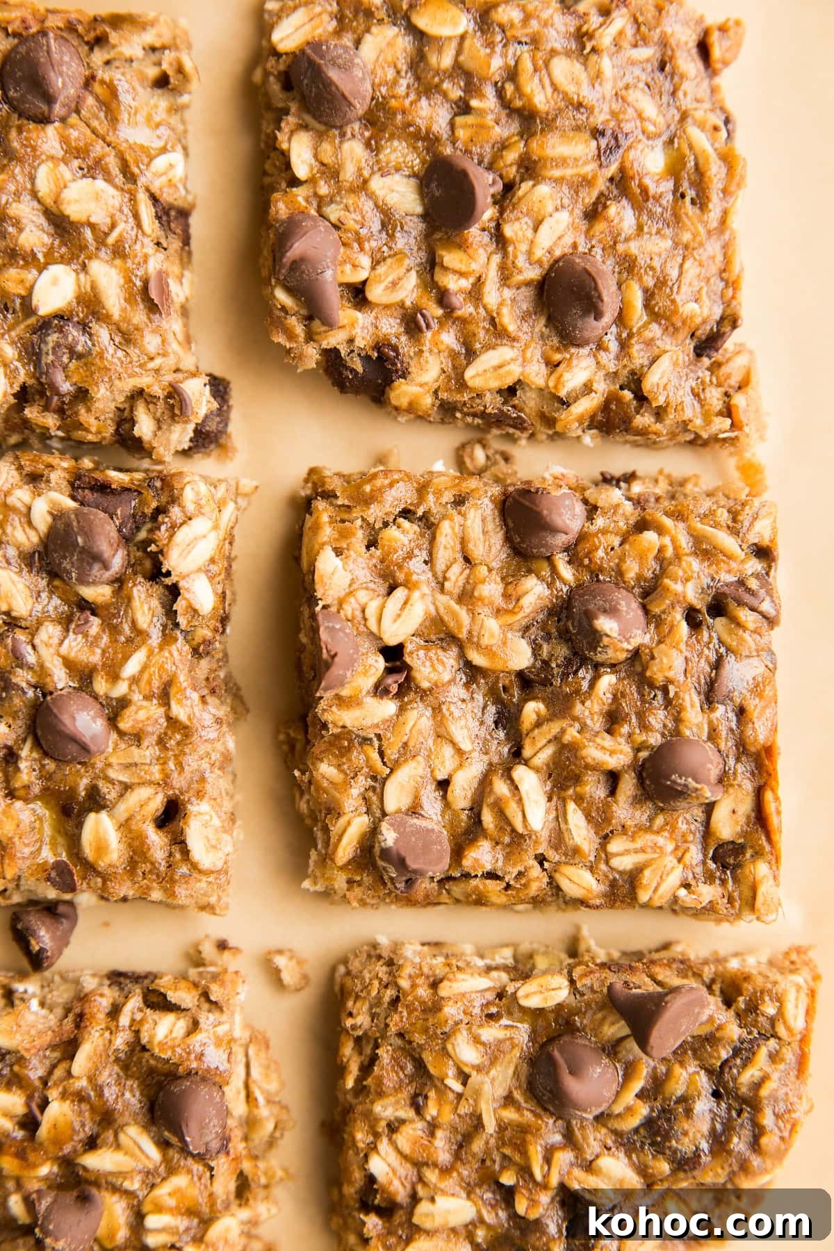 4-Ingredient Banana Oatmeal Bars Recipe for Quick Snacks 3 Healthy breakfast bars on a sheet of parchment paper