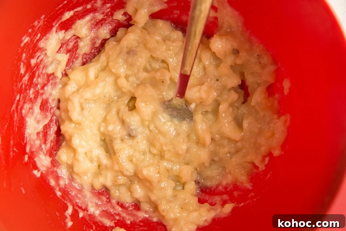4-Ingredient Banana Oatmeal Bars Recipe for Quick Snacks 5 Mashed banana in a mixing bowl