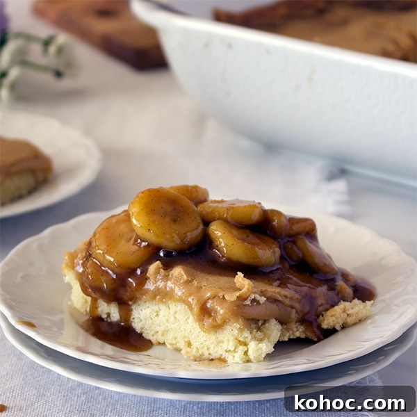 Banana Foster Butter Cake Recipe: Caramelized Bananas & Rum Glaze 5 A piece of Bananas Foster Cake on a white plate, ready to eat.