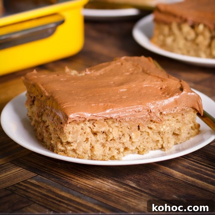 A slice of banana oat cake with chocolate buttercream on a plate.