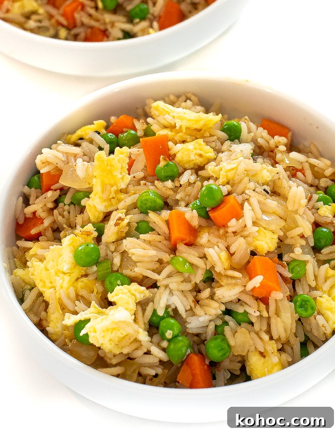 Perfect Instant Pot Fried Rice Recipe for Quick Weeknight Meals 2 White bowl filled with instant pot fried rice.