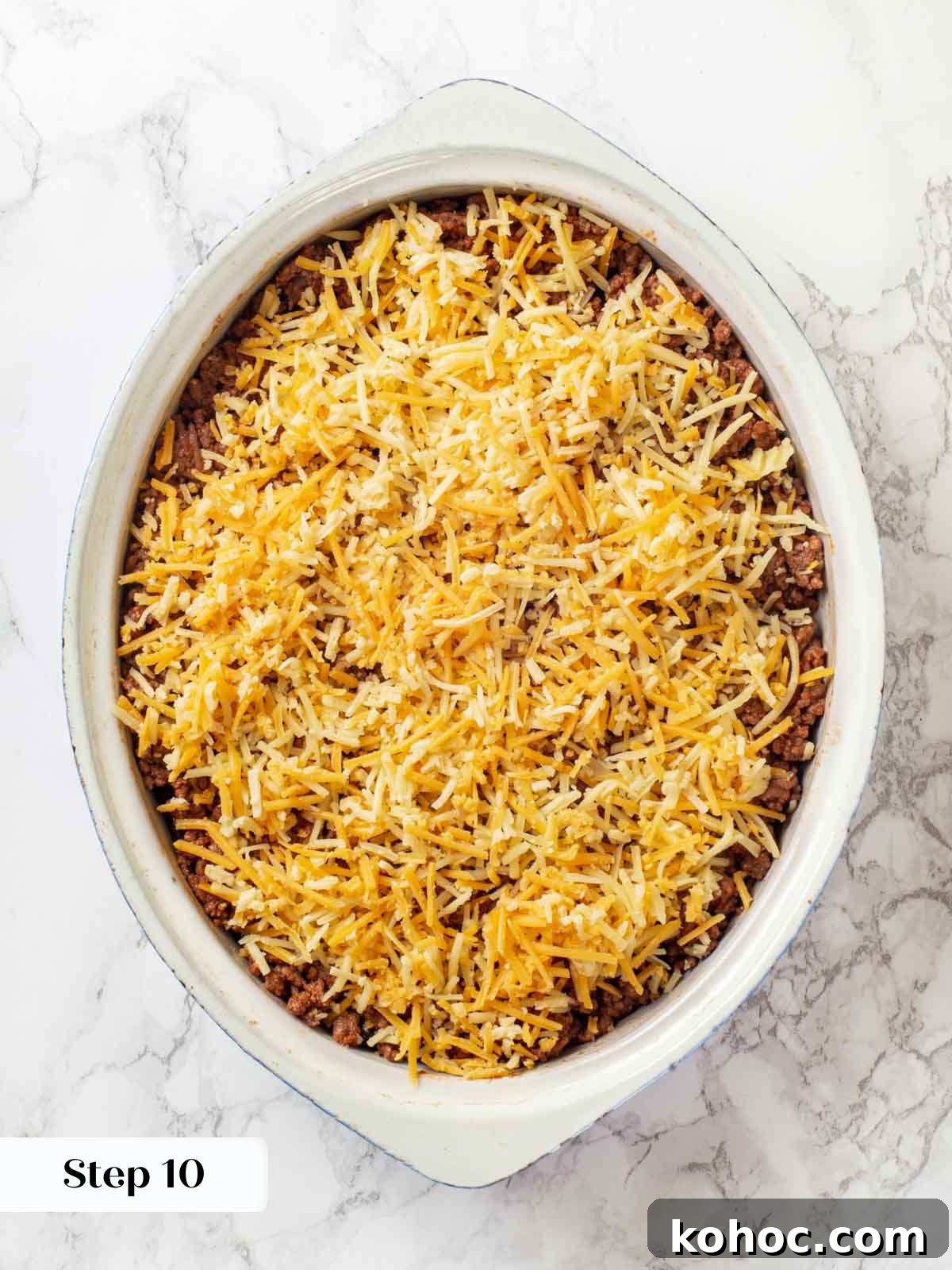 Cheesy Taco Casserole Bake with Ground Beef and Corn 12 fully layered and unbaked taco casserole.