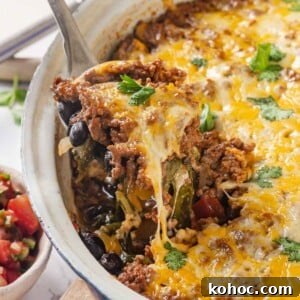 Cheesy Taco Casserole Bake with Ground Beef and Corn 15 taco bake melted cheese being served.