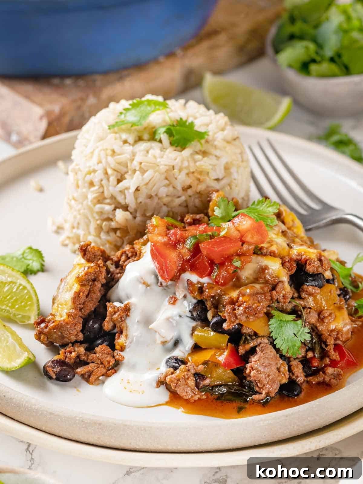 Cheesy Taco Casserole Bake with Ground Beef and Corn 3 taco bake served with rice.