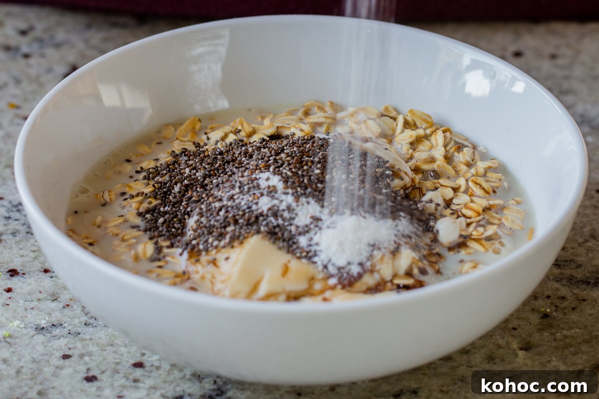 Baklava-Inspired Overnight Oats Recipe for Breakfast Bliss 10 adding chia seeds and vanilla powder to the oats
