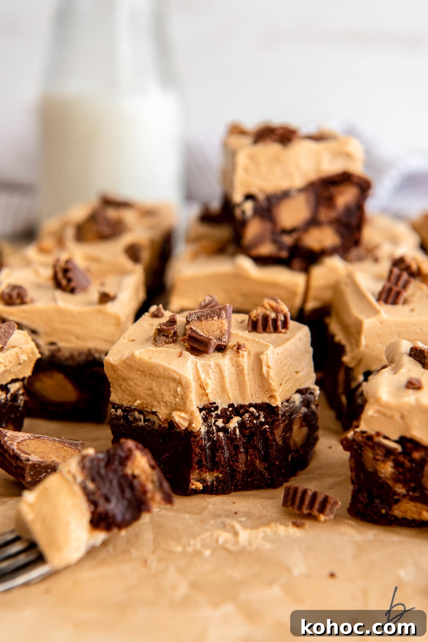 Frosted Peanut Butter Brownies Recipe — Rich Fudgy Chocolate Bars 7 frosted peanut butter brownie with a bite taken off the corner.