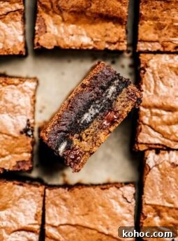 side of cookie dough oreo brownie in pan of brownie squares