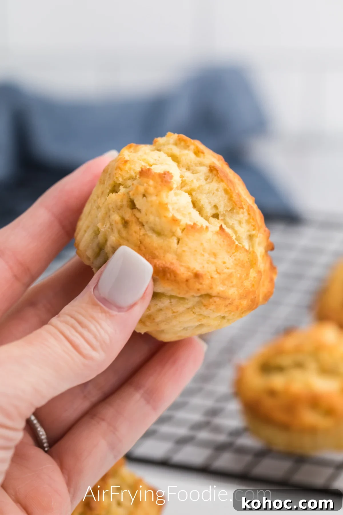 Air Fryer Banana Muffin in a hand ready to eat.