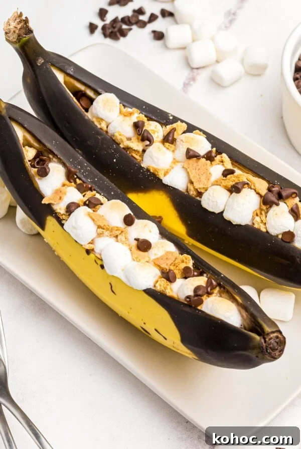 Bananas sliced open and stuffed with marshmallows and chocolate chips, then air fried.