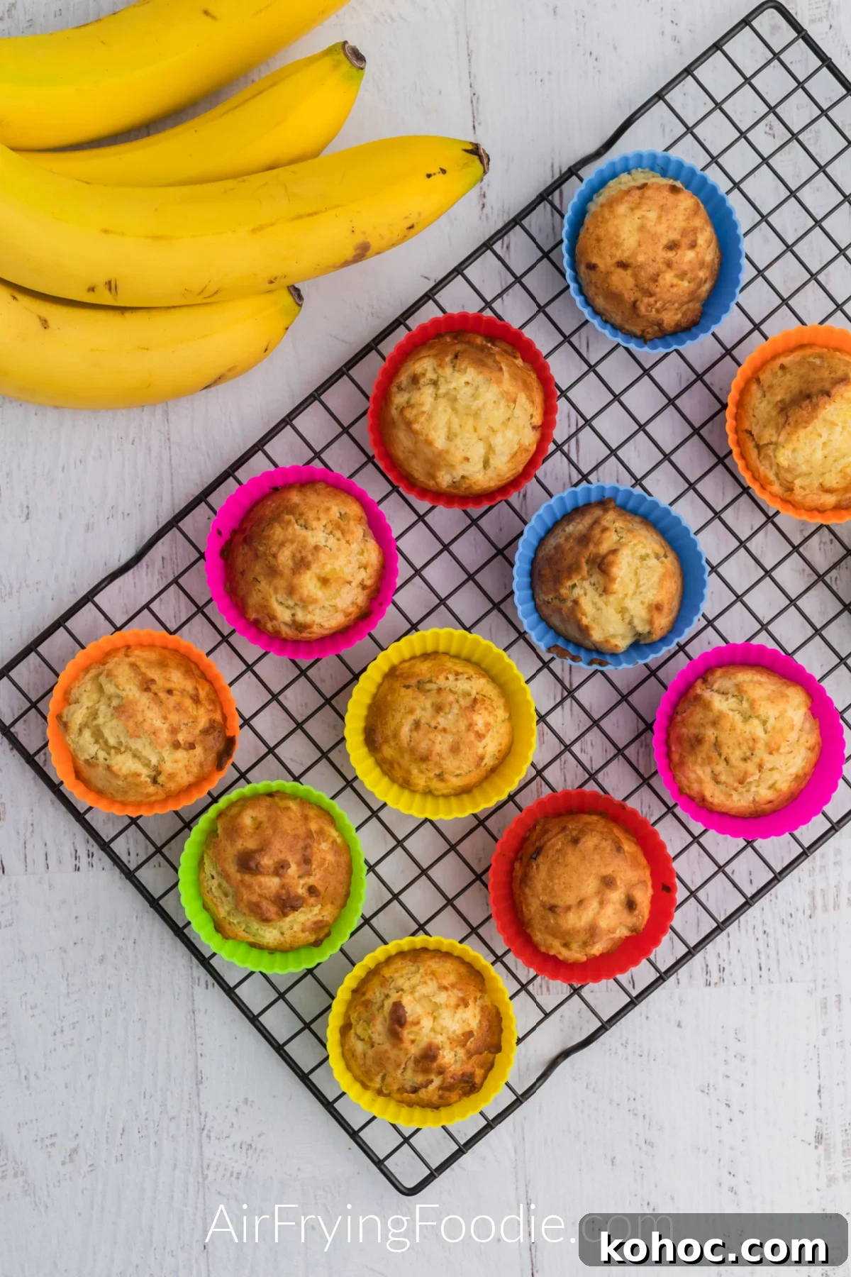 Banana muffins cooling on a wire rack. 