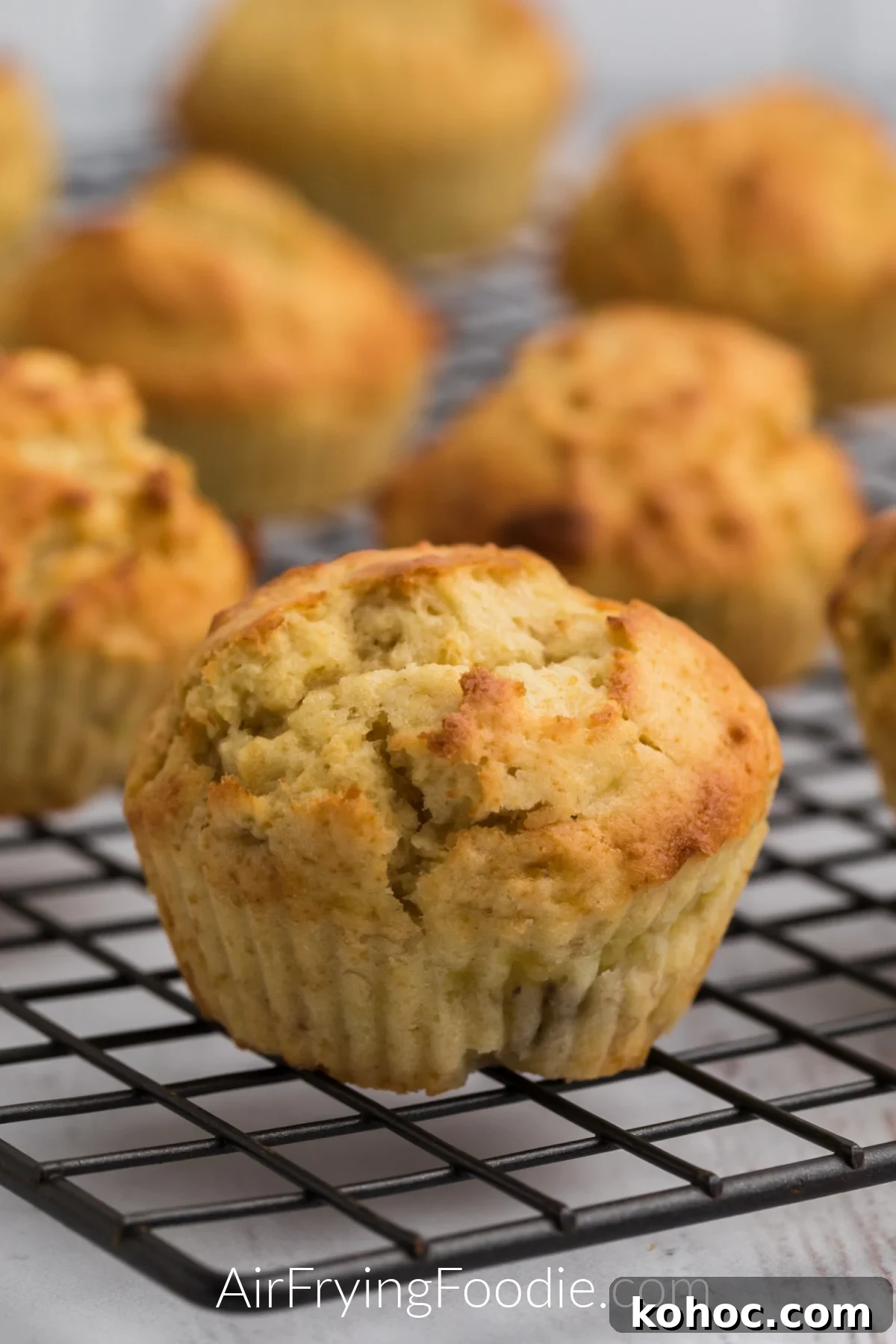 Close up photo of banana muffins on a cooling rack. 