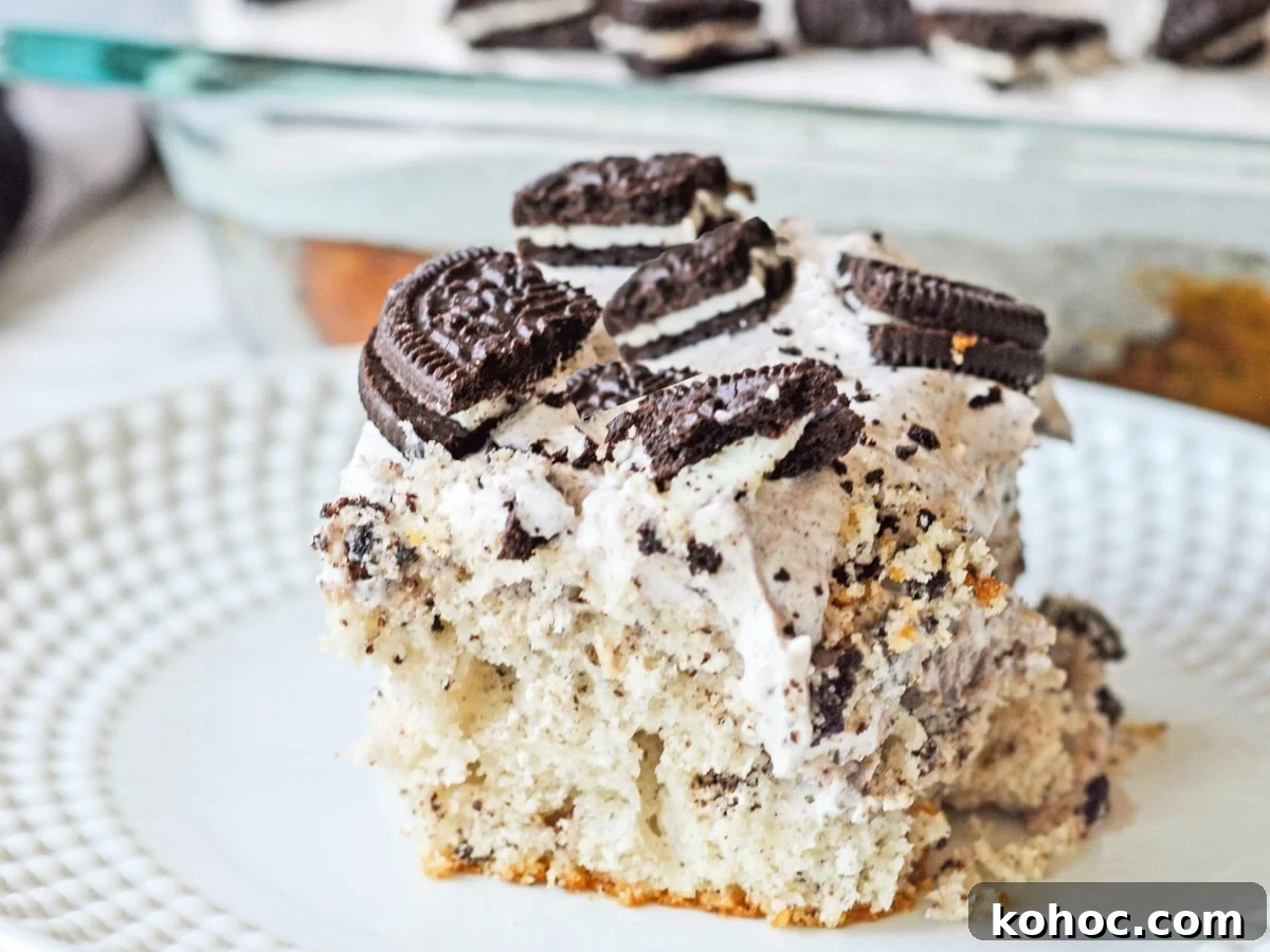 Simple Sheet Cake Recipes for Parties and Weeknight Desserts 5 Oreo Poke Cake slice on plate