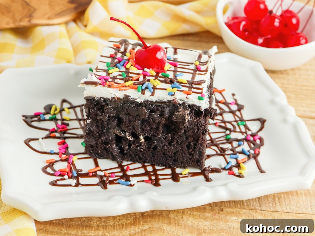 Simple Sheet Cake Recipes for Parties and Weeknight Desserts 10 Hot Fudge Sundae Poke Cake slice on a white plate