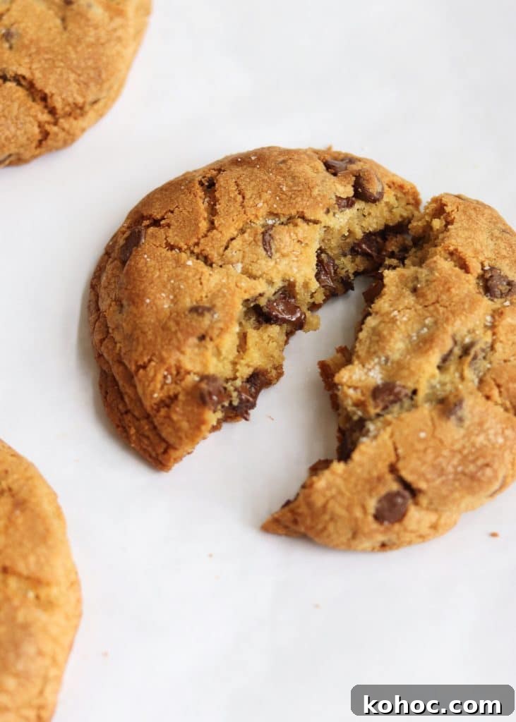 Thick Chewy Chocolate Chip Cookie Recipe 6 Warm chocolate chip cookie split in half to show the melted chocolate