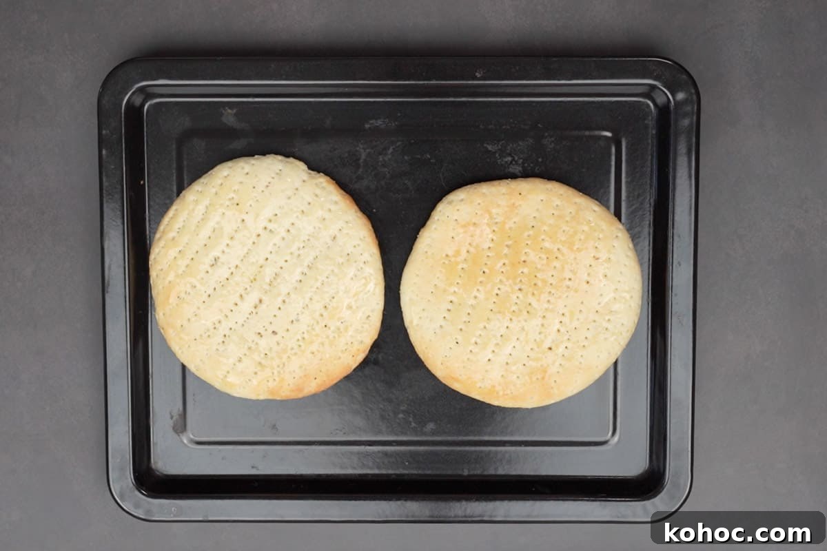 Authentic Bakarkhani Recipe: Flaky Bengali Bread Step-by-Step 16 Ready bakarkhani roti slathered with ghee.