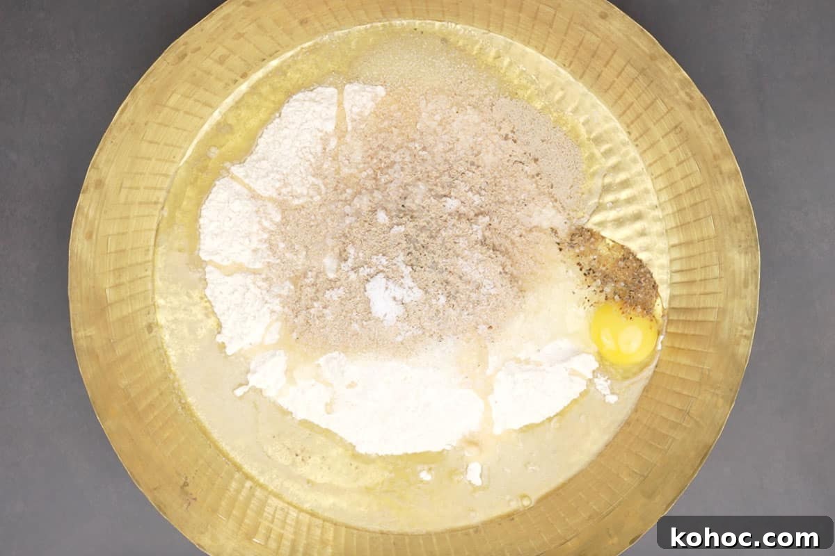 Authentic Bakarkhani Recipe: Flaky Bengali Bread Step-by-Step 3 All the ingredients added to a large bowl.