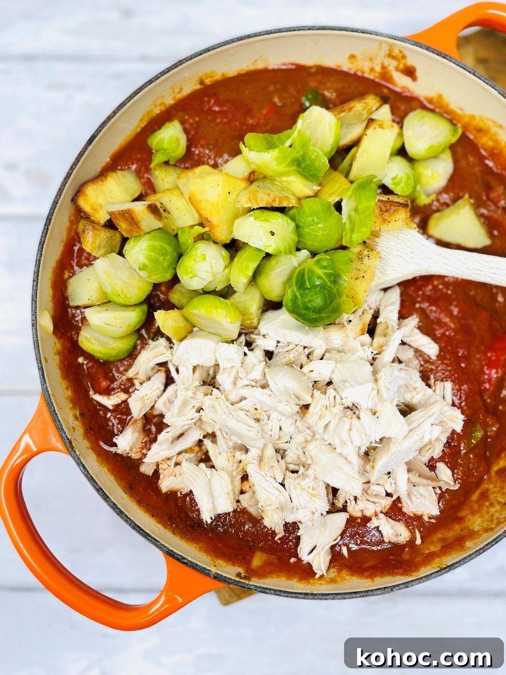 Leftover Turkey Curry Recipe for Quick Weeknight Meals 7 leftover turkey, sprouts and roast potatoes being stirred into a curry base sauce