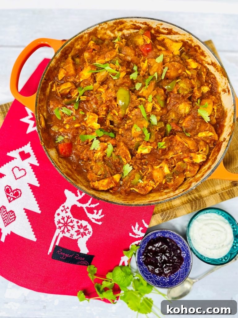 Leftover Turkey Curry Recipe for Quick Weeknight Meals 10 leftover christmas turkey curry in a skillet pan with cranberry sauce and mint yogurt dip