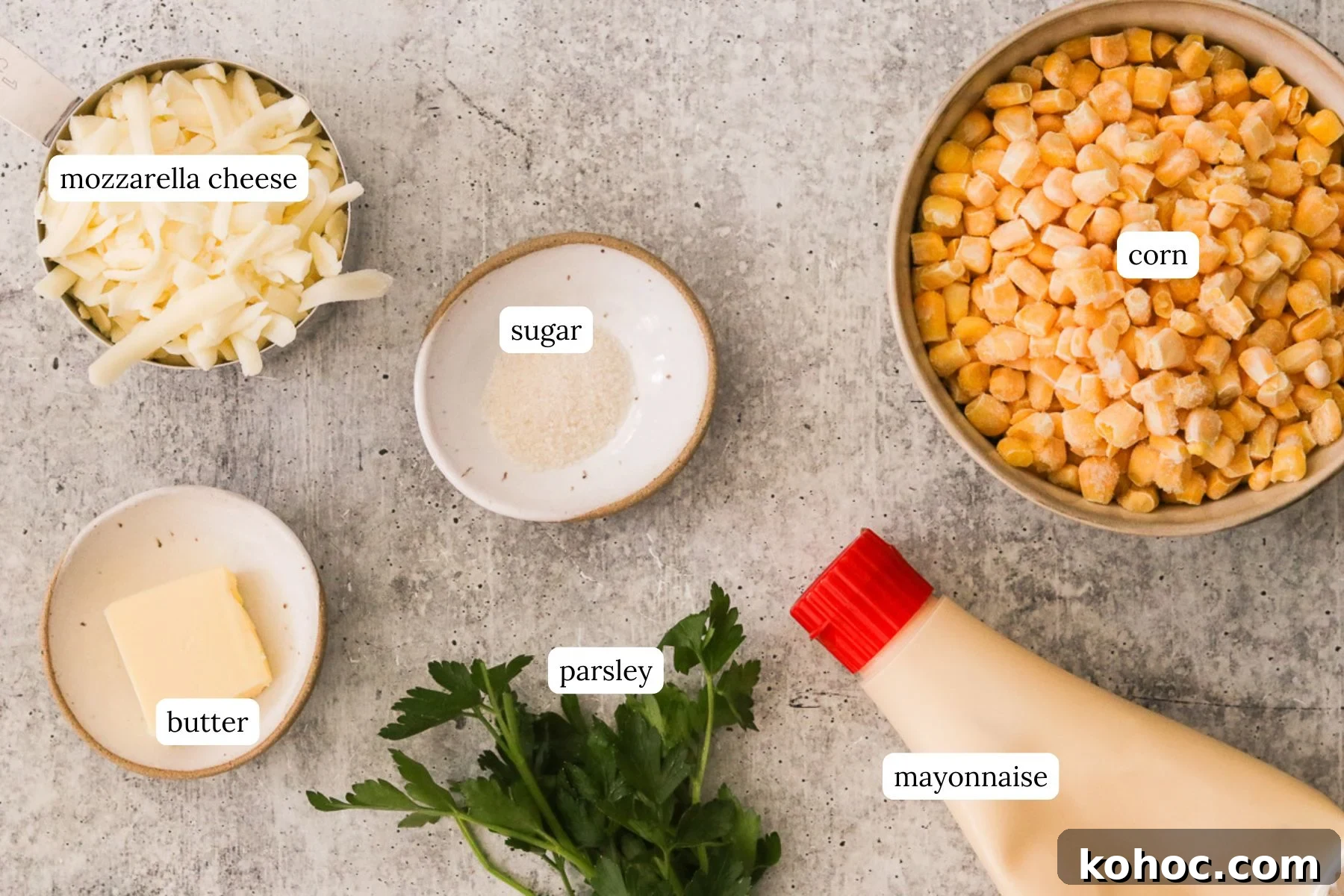 Korean Corn Cheese Recipe: Creamy Baked Koncheese for Sharing 3 Korean corn cheese recipe ingredients laid out and labeled on a gray countertop.