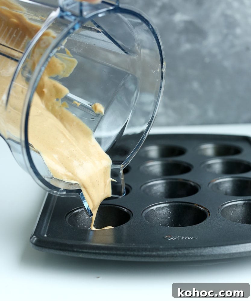 15 Quick 5-Ingredient Blender Muffin Recipes 4 Blender Muffins recipe pouring batter into muffin tin