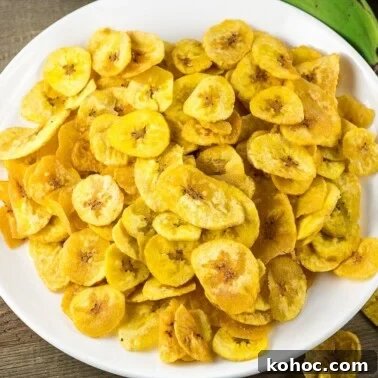 Crispy Sweet Fried Plantains (Tostones Maduros Recipe) 14 Plantain Chips on a white plate.