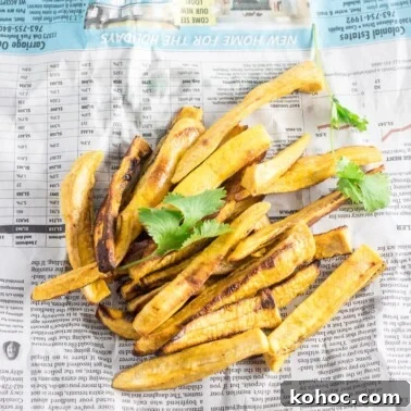 Crispy Sweet Fried Plantains (Tostones Maduros Recipe) 17 Fries on a newspaper.