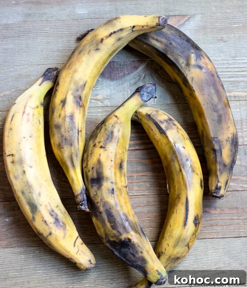 Crispy Sweet Fried Plantains (Tostones Maduros Recipe) 3 5 yellow ripe plantains on a wooden board.