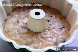 Moist Blueberry Cake with Creamy Sour Cream Frosting 7 Baked cake cooling