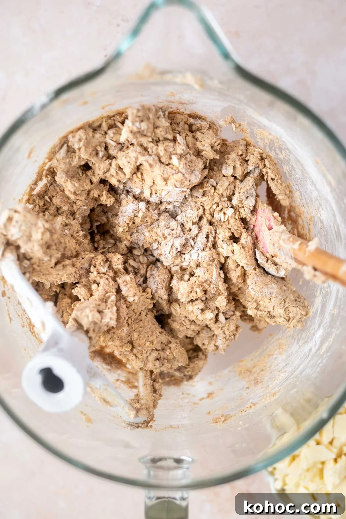 Chewy Brown-Butter Oatmeal Cookies with Sea Salt 6 oatmeal cookie dough in a mixing bowl with a spatula showing just a few streaks of flour