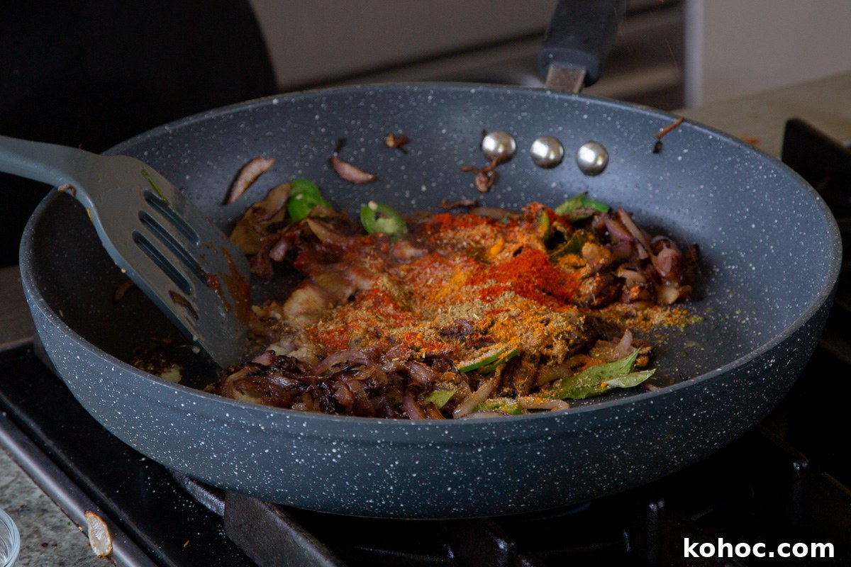 South Indian Black Pepper Tofu Curry with Caramelized Onions 14 adding spices to the onion mixture