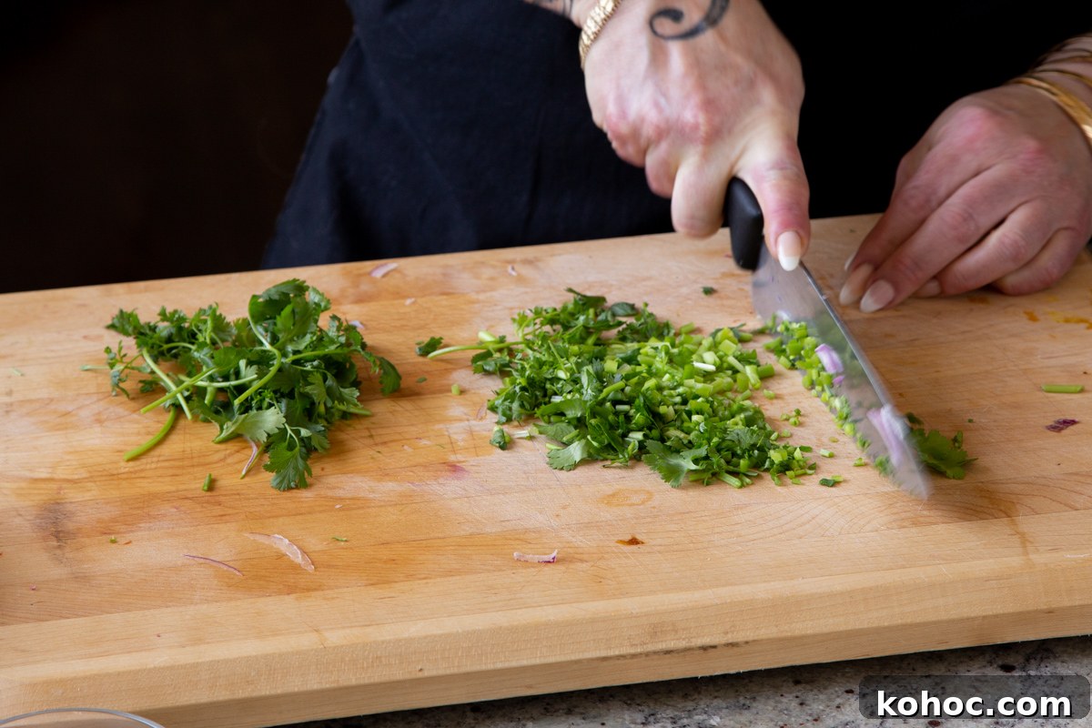 South Indian Black Pepper Tofu Curry with Caramelized Onions 8 chopping cilantro and green chilis