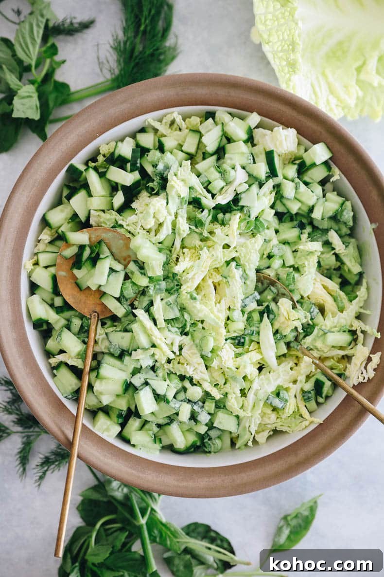Green Goddess Salad Recipe with Avocado Dressing 2 green goddess salad in a white and brown bowl.