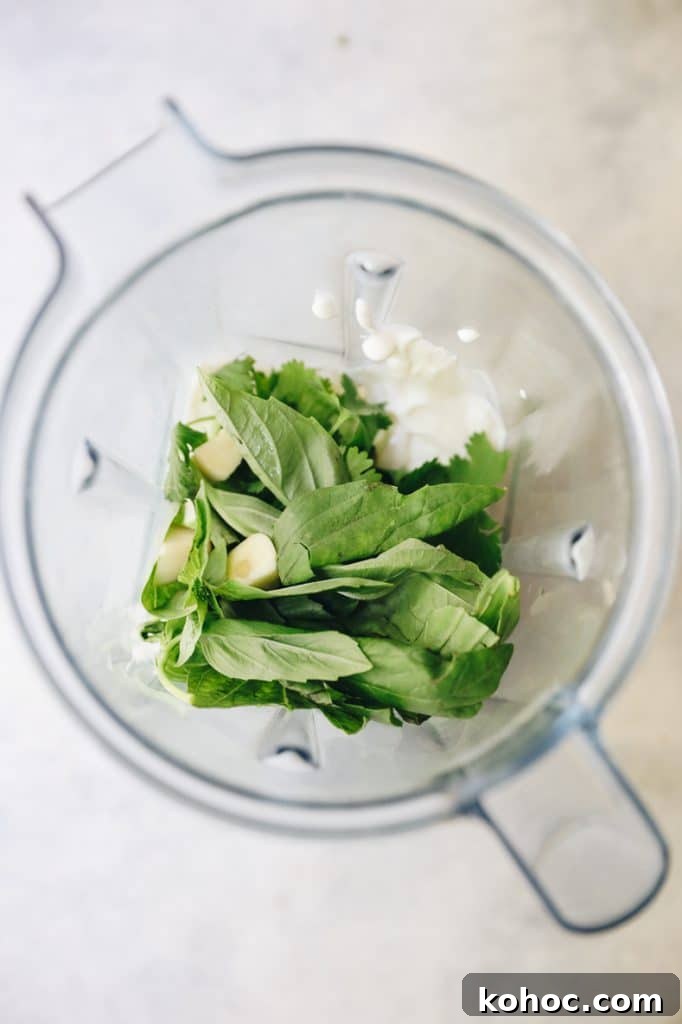 Green Goddess Salad Recipe with Avocado Dressing 3 green goddess dressing ingredients in a blender.