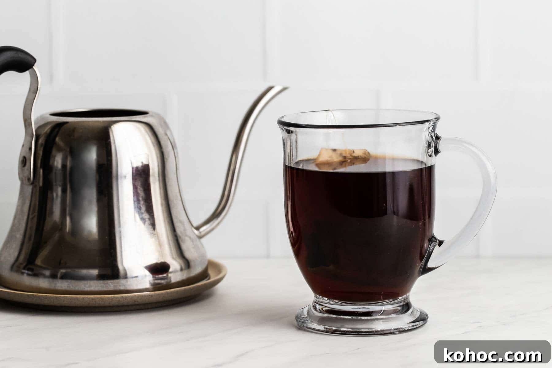 Starbucks London Fog Latte Copycat Recipe: How to Make It at Home 4 Earl Grey tea steeping in clear glass mug.
