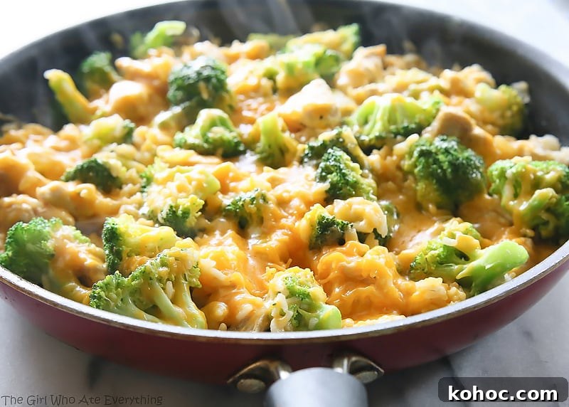One-Pan Cheesy Chicken, Broccoli, and Rice in a skillet