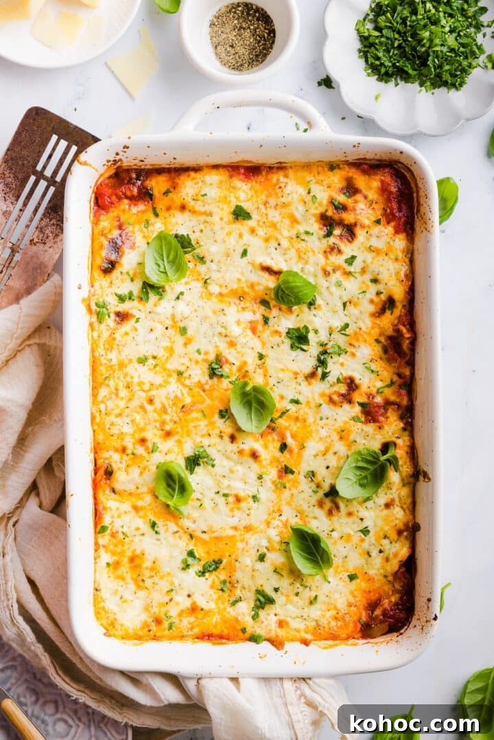 High-Protein Lazy Lasagna Recipe for Quick Meals 2 Birdseye photo of a cheesy, lazy, high protein lasagna garnished with fresh basil leaves