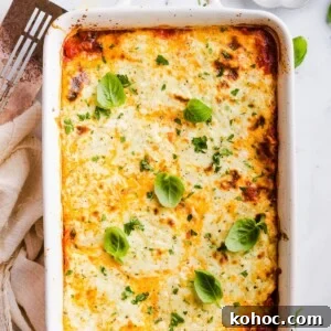High-Protein Lazy Lasagna Recipe for Quick Meals 14 Birdseye photo of a cheesy, lazy, high protein lasagna garnished with fresh basil leaves