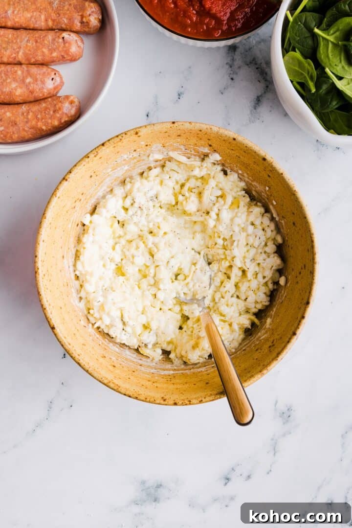 High-Protein Lazy Lasagna Recipe for Quick Meals 5 Cheese mixture for lasagna mixed in a brown mixing bowl