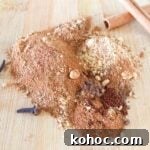 Homemade Pumpkin Pie Spice Recipe for 1 Tablespoon (Quick Mix) 10 Spices for homemade pumpkin pie spice recipe on a wooden cutting board with cinnamon sticks and whole cloves.