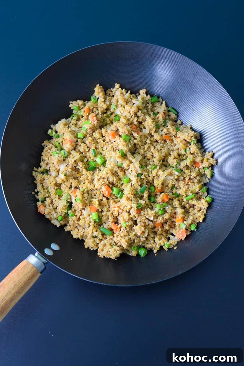 Quinoa Fried Rice: Flavorful Stir-Fry with Veggies and Egg 3 Quinoa Fried Rice in Wok Pan