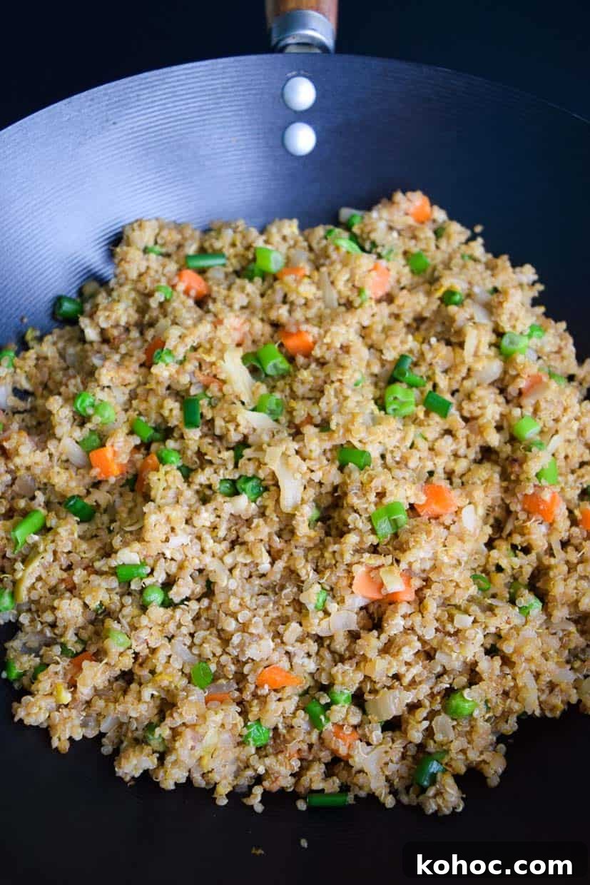 Quinoa Fried Rice: Flavorful Stir-Fry with Veggies and Egg 4 Quinoa Fried Rice in Wok Pan close up