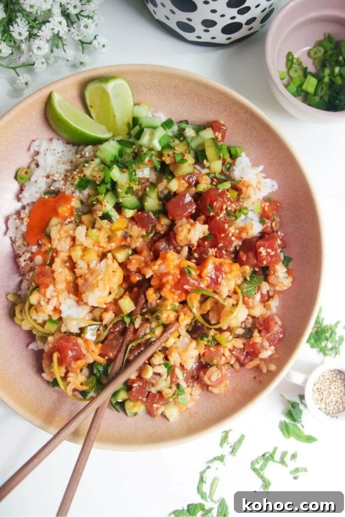 Juicy Chicken Poke Bowl Recipe for Fresh, Flavor-Packed Meals 12 Tuna poke bowl with chopsticks on the side.