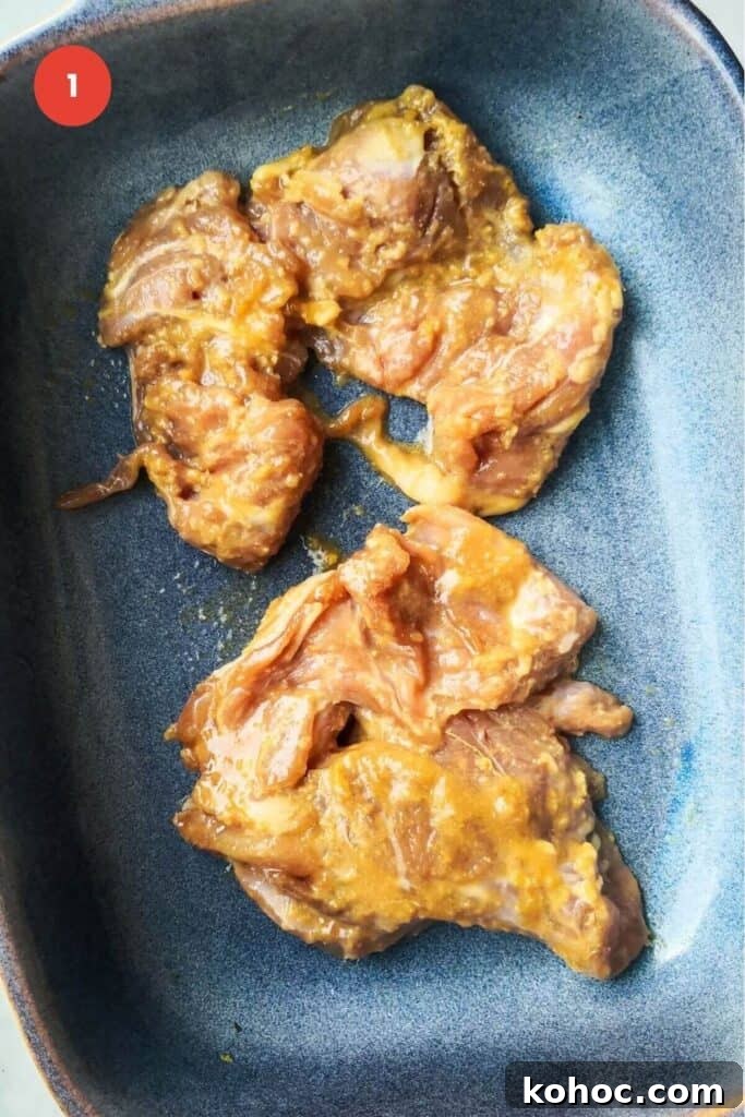 Juicy Chicken Poke Bowl Recipe for Fresh, Flavor-Packed Meals 4 Marinated chicken thighs in a baking dish.