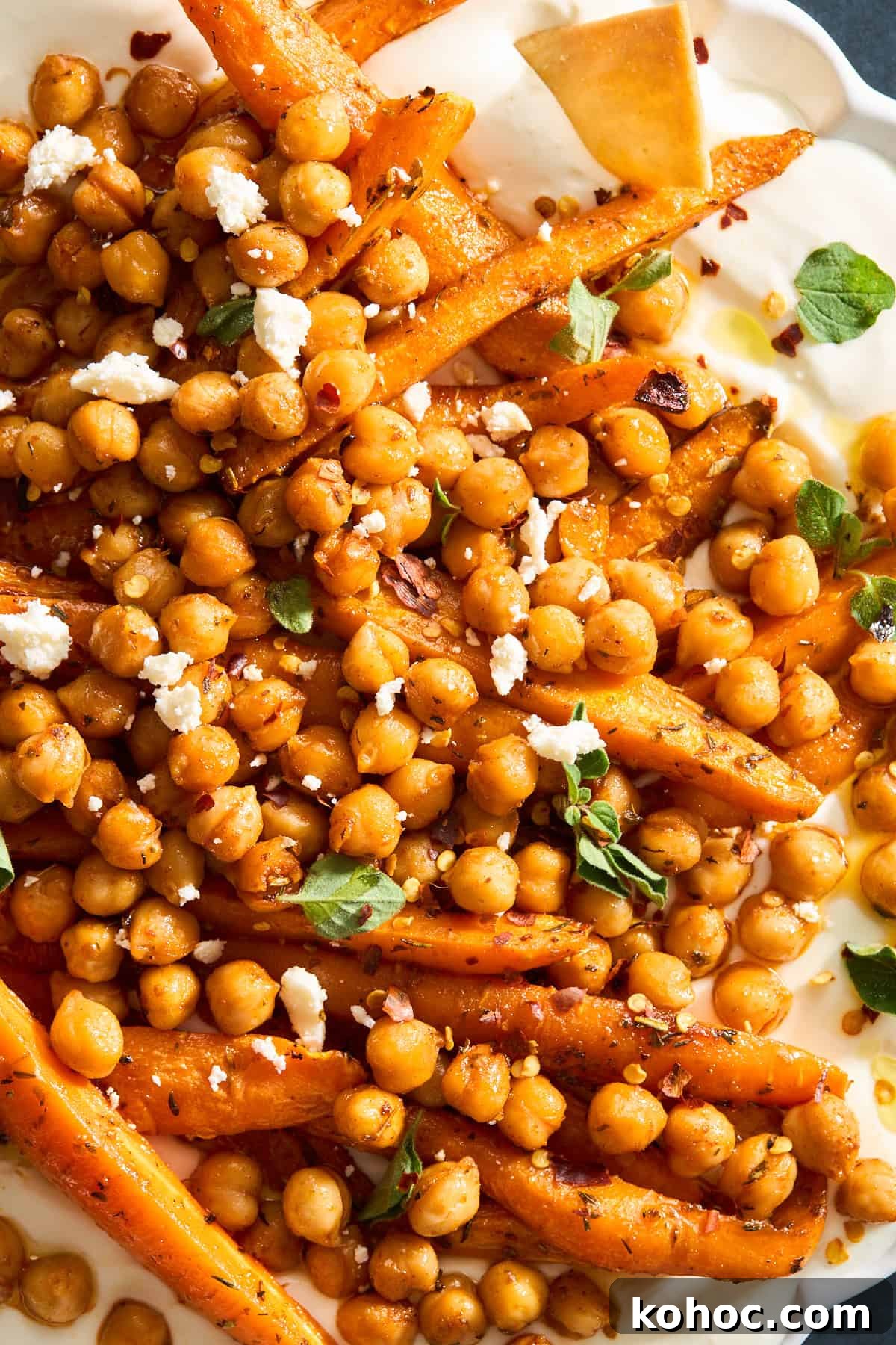 Roasted Carrots & Chickpeas with Creamy Whipped Feta 7 Close up image of chickpeas and roasted carrots over whipped feta.