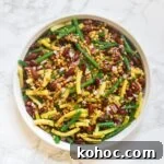 A top down view of a bowl of bean salad with lentils.